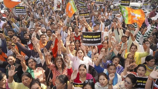 <div class="paragraphs"><p>BJP leaders and workers stage a protest against AAP supremo Arvind Kejriwal, alleging the use of 'extravagant luxurious items' for the renovation of the official bungalow that was earlier occupied by him as Delhi chief minister, in New Delhi, Thursday, November 21, 2024.</p></div>