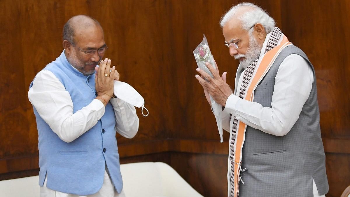 <div class="paragraphs"><p>Narendra Modi (R) with Manipur CM N Biren Singh.</p></div>