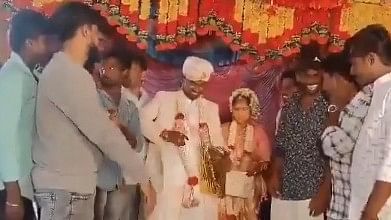 <div class="paragraphs"><p>In a video circulating online, the man can be seen losing his balance on the stage after he wishes the couple and hands them a gift as the crowd cheers them on.</p></div>