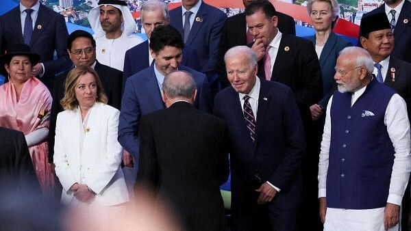 <div class="paragraphs"><p>US President Joe Biden greets a person as Italy's Prime Minister Giorgia Meloni, Indian Prime Minister Narendra Modi, German Chancellor Olaf Scholz, French President Emmanuel Macron and other world leaders gather for a group photo during the G20 summit in Rio de Janeiro, Brazil, November 19, 2024.</p></div>