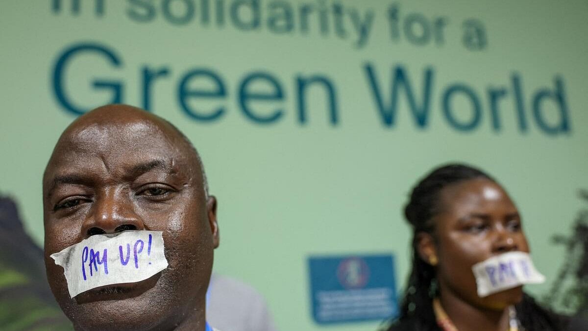 <div class="paragraphs"><p>Activists hold a protest calling on developed nations to provide financing to fight climate change, during the COP29 United Nations Climate Change Conference, in Baku.</p></div>