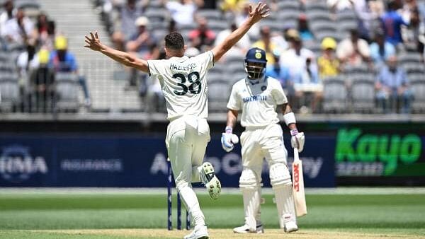 <div class="paragraphs"><p>Australia's Josh Hazlewood celebrates after taking the wicket of India's Virat Kohli.</p></div>