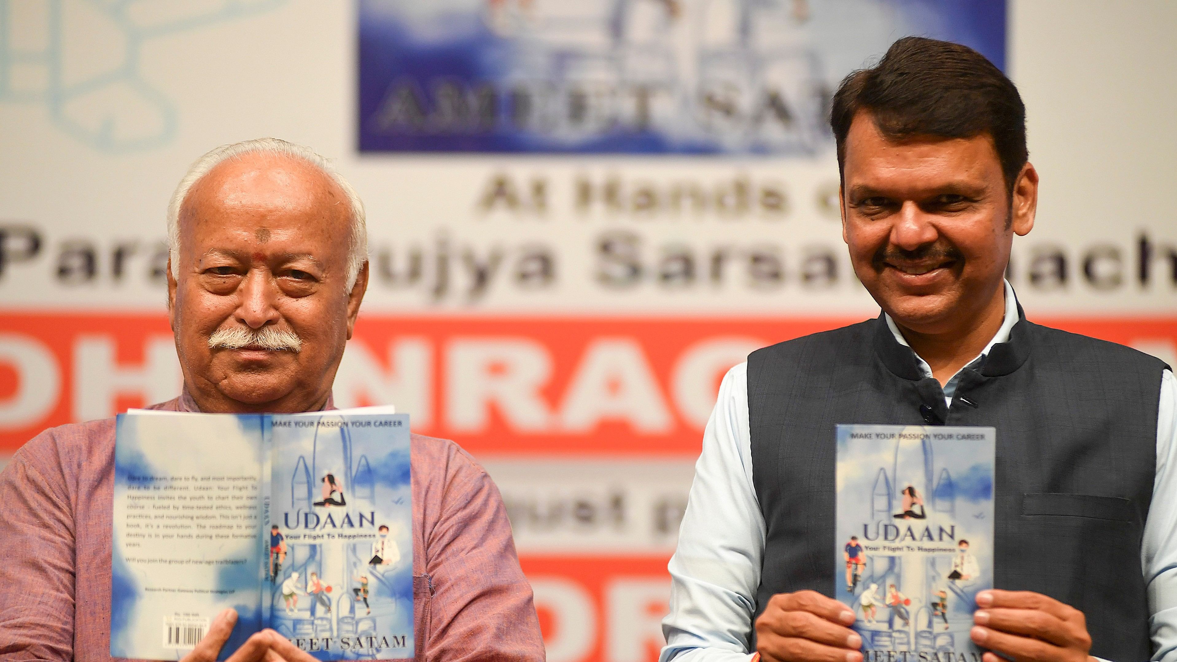 <div class="paragraphs"><p>File Photo: RSS Chief Mohan Bhagwat with Maharashtra Dy Chief Minister Devendra Fadnavis releases the book 'Udaan', in Mumbai.</p></div>