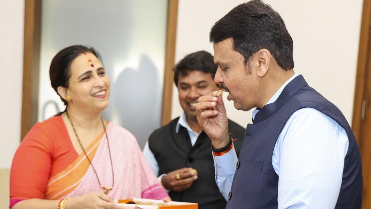 <div class="paragraphs"><p>Devendra Fadnavis being greeted by the state BJP Mahila Morcha President Chitra Kishor Wagh after the counting of votes in Maharashtra.&nbsp;</p></div>