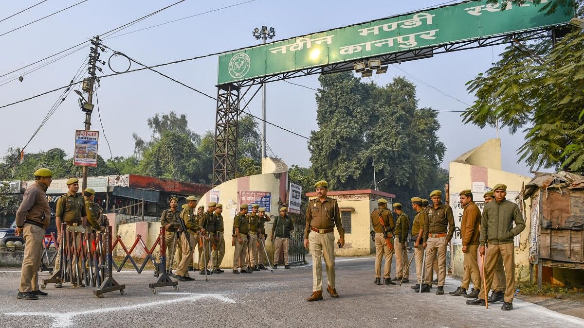 <div class="paragraphs"><p>Police and security personnel stand guard outside a counting center amid the counting of votes for the Sisamau Assembly by-election in Kanpur.&nbsp;</p></div>