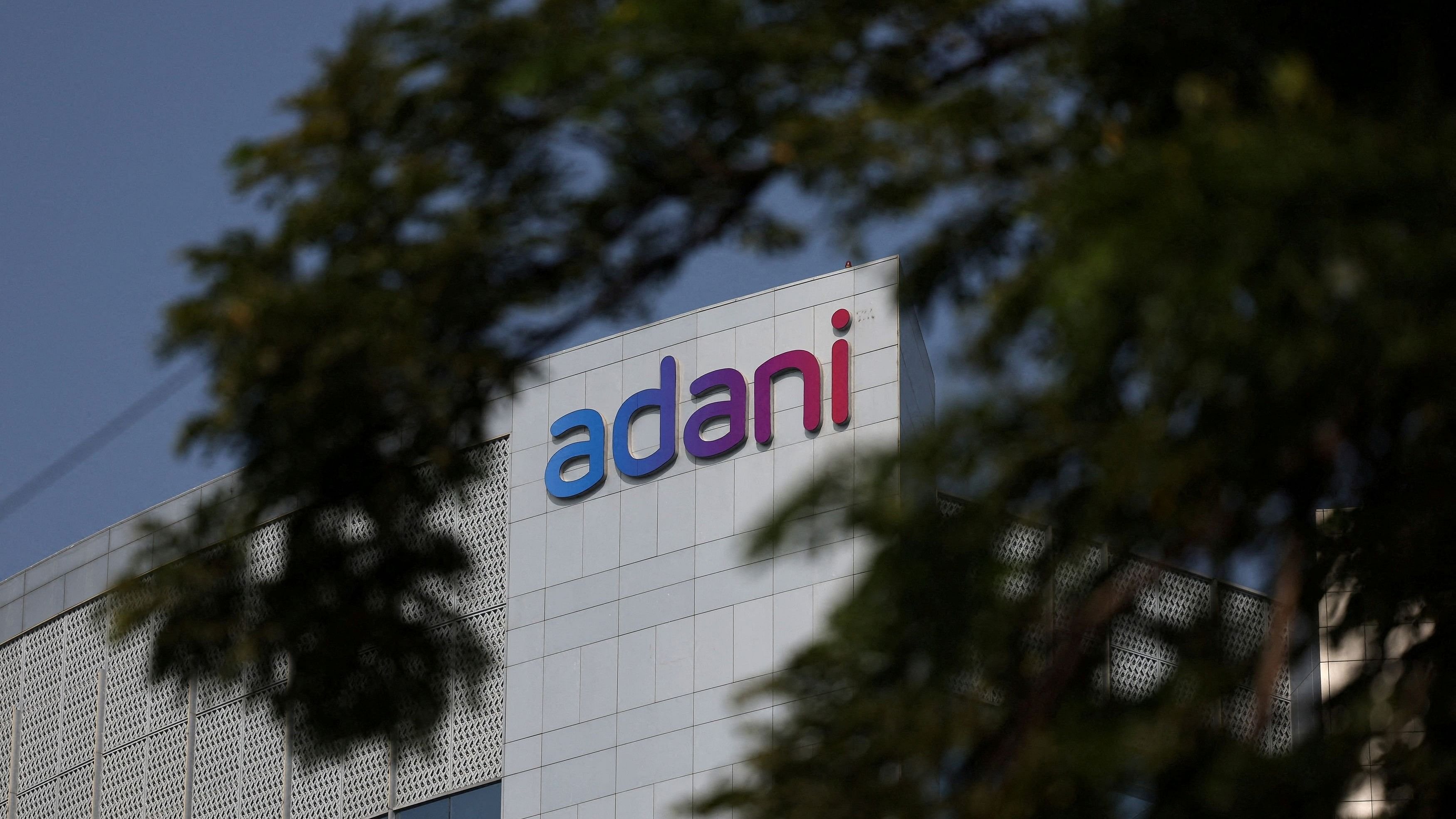 <div class="paragraphs"><p>FILE PHOTO: The logo of the Adani Group is seen on the facade of its Corporate House on the outskirts of Ahmedabad, India, November 21, 2024. </p></div>