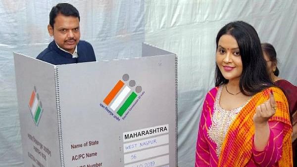 <div class="paragraphs"><p>Maharashtra Chief Minister Devendra Fadnavis seen here with his wife Amruta</p></div>