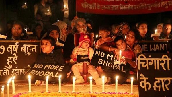 <div class="paragraphs"><p>Children with congenital disabilities, believed to be caused by the exposure of their parents to gas leakage during the Union Carbide gas leak disaster in 1984, along with their relatives and supporters take part in a candlelight vigil to pay homage to the victims of the tragedy, in Bhopal.</p></div>