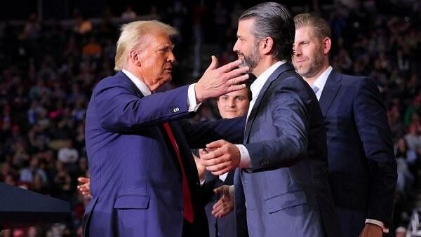 <div class="paragraphs"><p>US President-elect Donald Trump seen here reaching out to embrace Donald Trump Jr at his campaign rally in Pittsburgh, Pennsylvania, US on November 4</p></div>