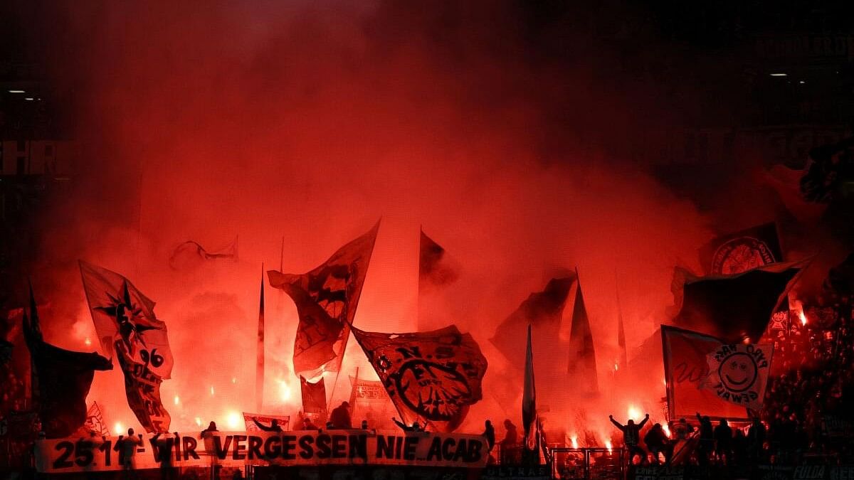 <div class="paragraphs"><p>Soccer Football - Bundesliga - Eintracht Frankfurt v Werder Bremen - Deutsche Bank Park, Frankfurt, Germany - November 23, 2024 Eintracht Frankfurt fans lets off flares in the stands before the match</p></div>