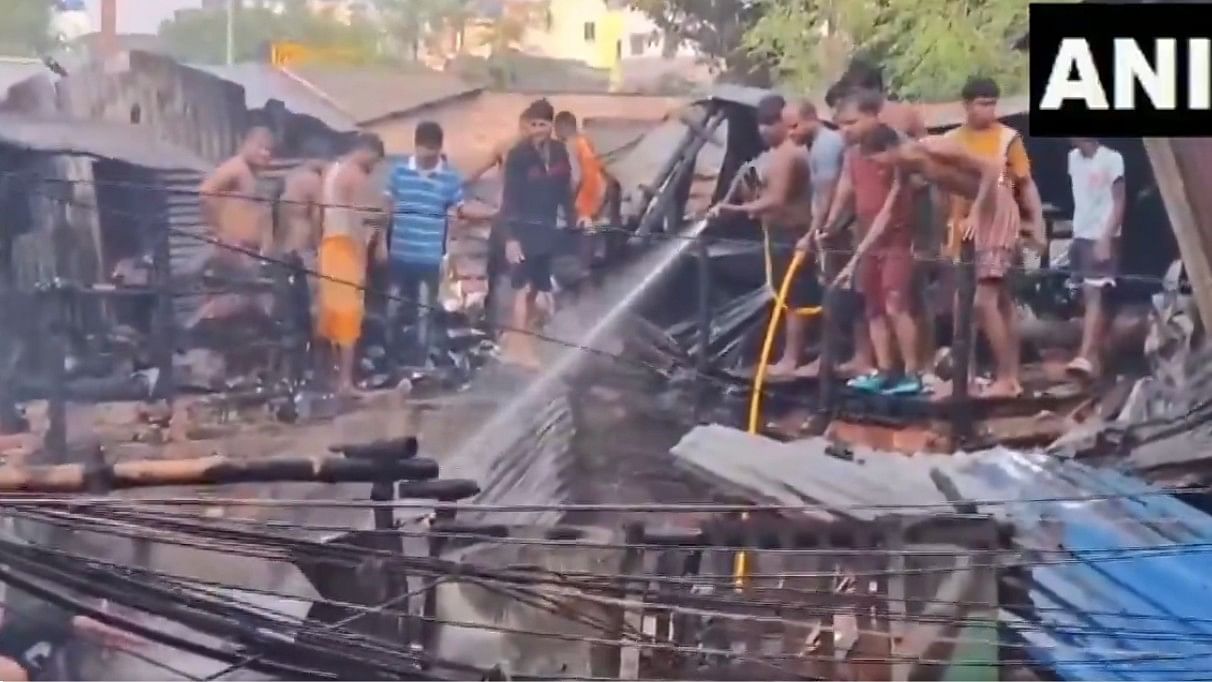 <div class="paragraphs"><p>Screengrab from the video showing people trying to douse the fire.</p></div>