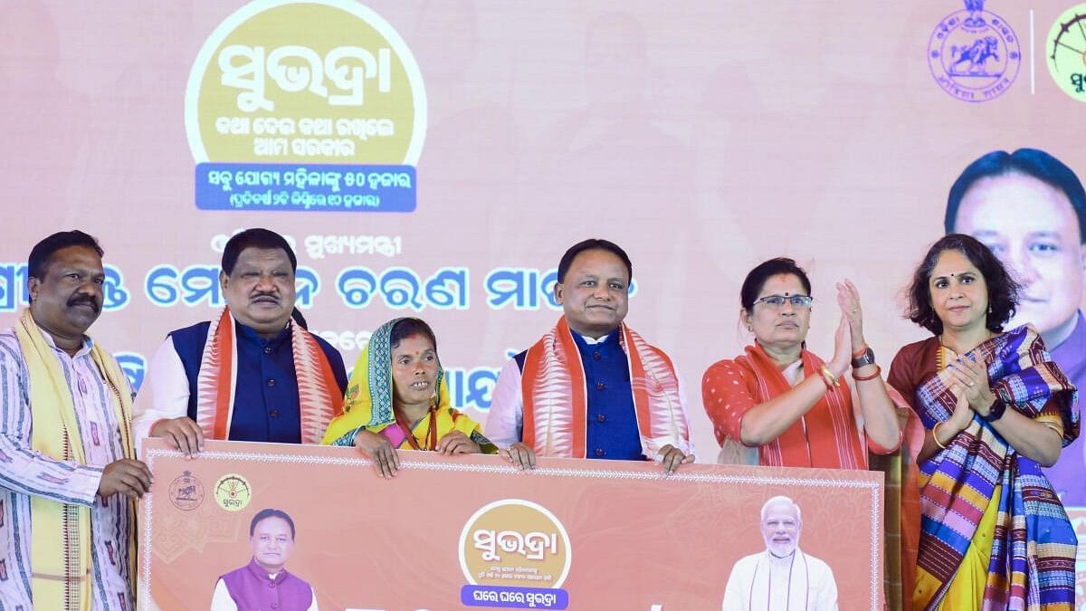 <div class="paragraphs"><p>Odisha Chief Minister Mohan Charan Majhi with Union Minister for tribal Affairs Jual Oram, DY CM Pravati Parida during distribution of the third phase of first instalment to beneficiaries under the Subhadra Yojana scheme, in Sundargarh</p></div>