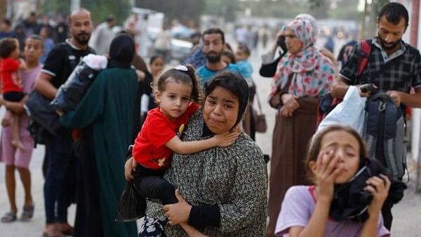 <div class="paragraphs"><p>People flee their homes located in the Gaza Strip. Representative image&nbsp;</p></div>