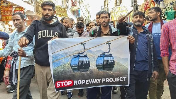 <div class="paragraphs"><p>People take part in a protest march during the fourth day of a strike against a proposed ropeway project along the trek route to the Vaishno Devi shrine, at Katra in Reasi district, Jammu &amp; Kashmir, Monday, Nov. 25, 2024.</p></div>