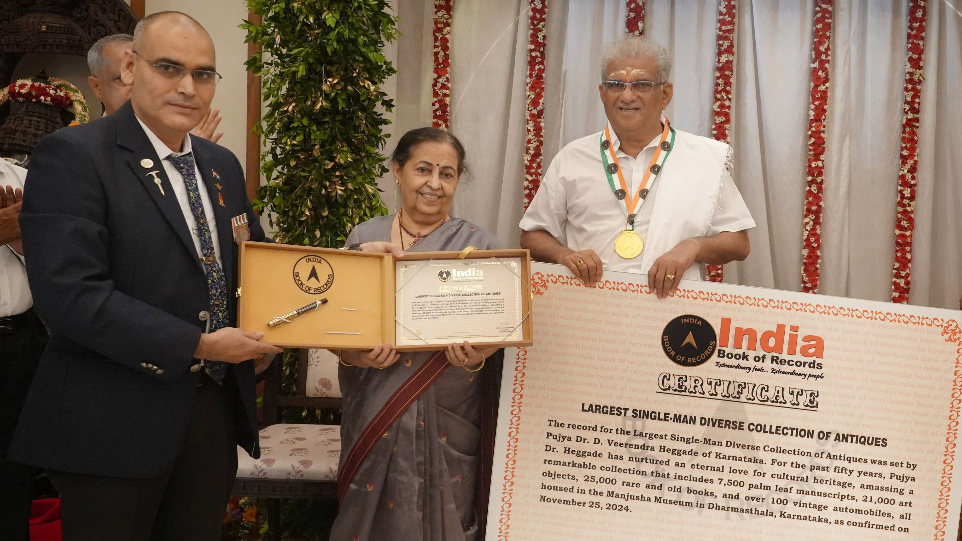 <div class="paragraphs"><p>India Book of Records head Dr Anil Kumar Sharma hands over special recognition from the India Book of Records under "Largest single man diverse collection of antiques' category for Manjusha Museum, to Dharmasthala Dharmadhikari D Veerendra Heggade.</p></div>