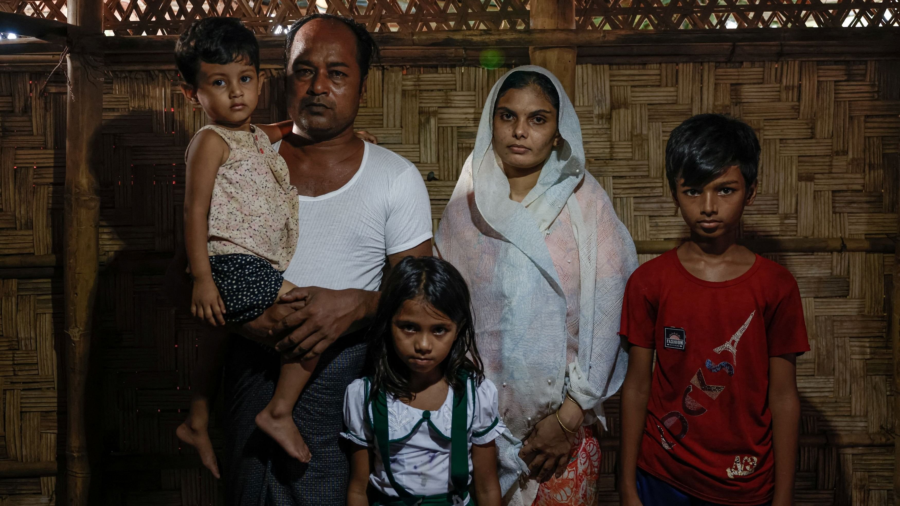 <div class="paragraphs"><p>Sharit Ullah, a newly arrived Rohingya refugee, and members of his family pose for a picture inside a shelter at a camp in Cox's Bazar, Bangladesh.</p></div>