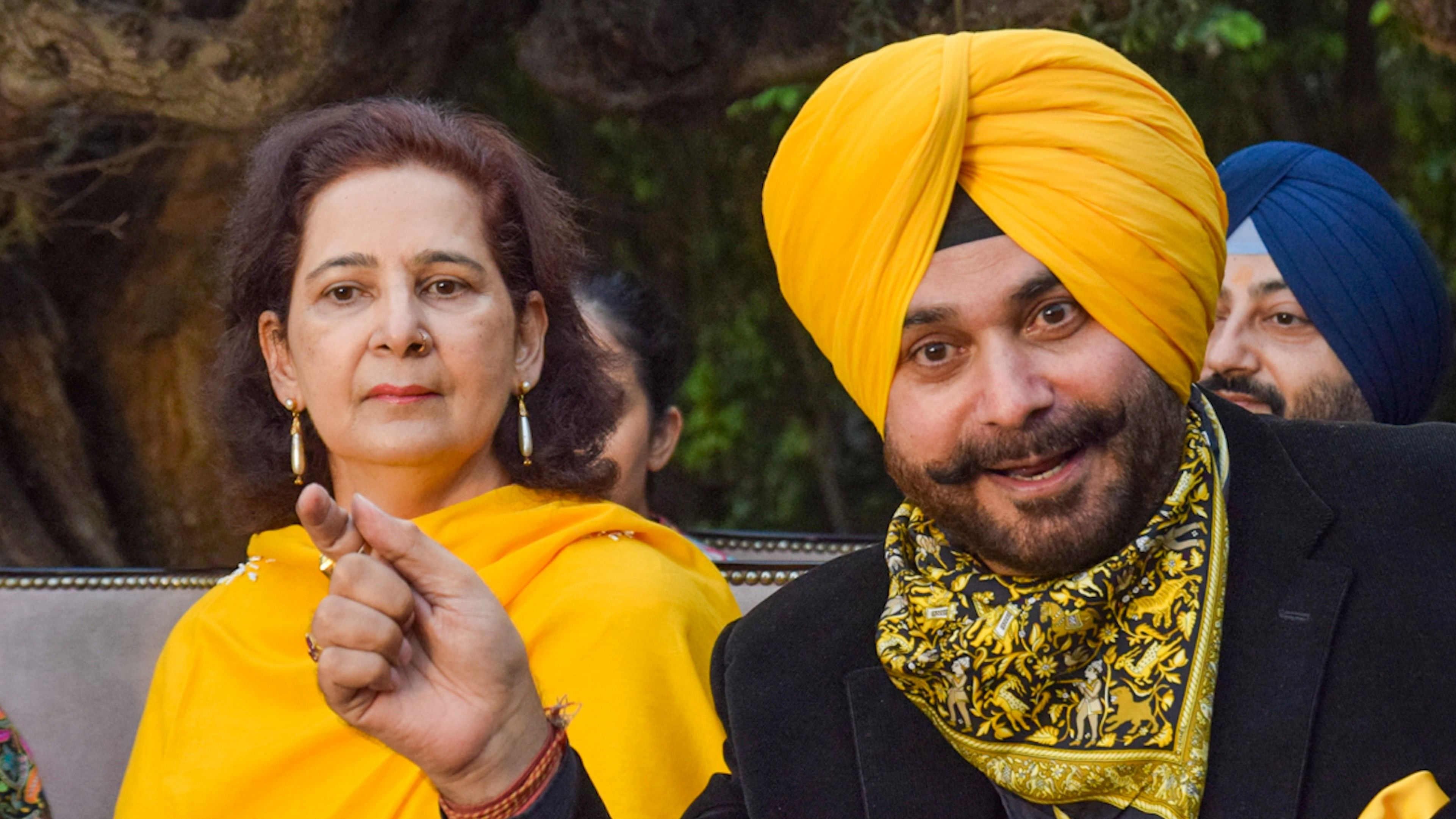 <div class="paragraphs"><p>Congress leader Navjot Singh Sidhu with his wife Navjot Kaur Sidhu addresses a press conference, in Amritsar, Thursday, Nov. 21, 2024. </p></div>