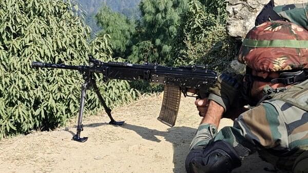 <div class="paragraphs"><p>An army personnel equipped with Light Machine Gun (LMG) deployed at a strategic location of hinterland, in Rajouri.&nbsp;</p></div>