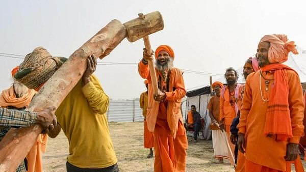 <div class="paragraphs"><p> Sadhus take part in 'Dharam Dhwaja Puja' ceremony of Panch Dasnam Aagni Akhara ahead of Mahakumbh 2025, in Prayagraj.</p></div>