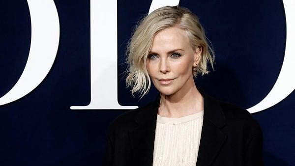 <div class="paragraphs"><p>Charlize Theron poses during a photocall before Dior Fall-Winter 2023/2024 Women's ready-to-wear collection show during Paris Fashion Week in Paris.</p></div>