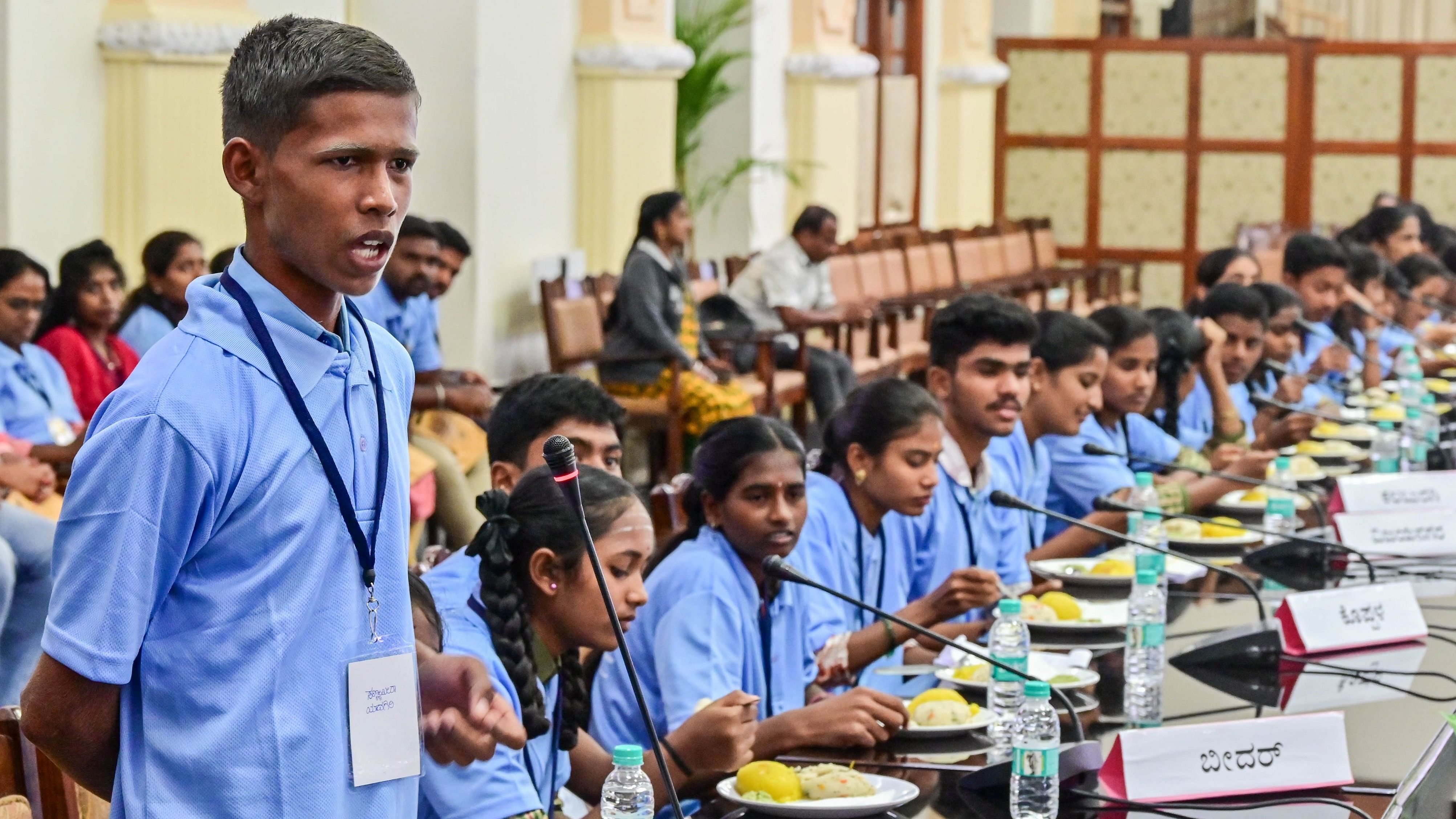 <div class="paragraphs"><p>A student poses a query at the Karnataka Child Rights Parliament held in Bengaluru on Monday.</p></div>