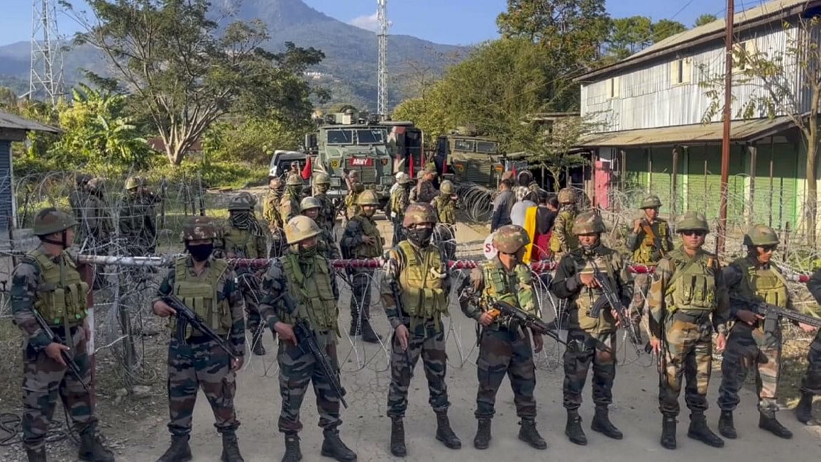 <div class="paragraphs"><p>Soldiers guard a trouble torn area in Manipur.&nbsp;</p></div>