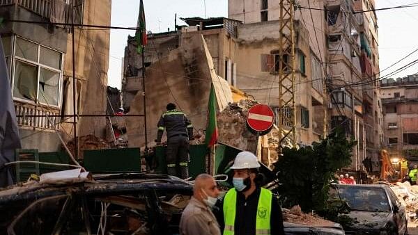 <div class="paragraphs"><p>First responders work at the site of an Israeli strike, amid hostilities between Hezbollah and Israeli forces, in Beirut</p></div>