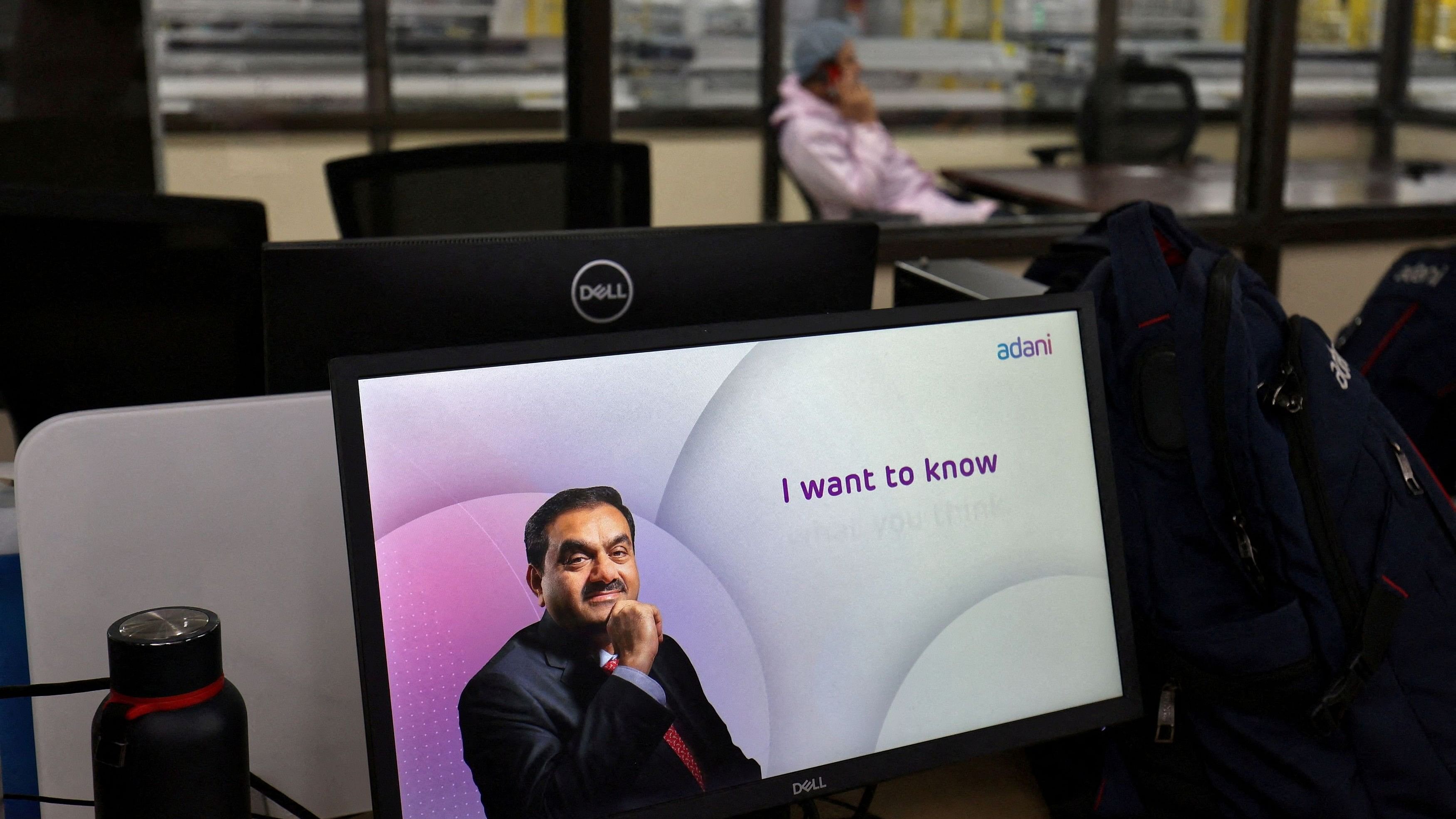 <div class="paragraphs"><p>FILE PHOTO: A technician talks on his cell phone at the Photovoltaic Modules assembling plant of Adani Green Energy Ltd , in Mundra, India, April 11, 2024. </p></div>