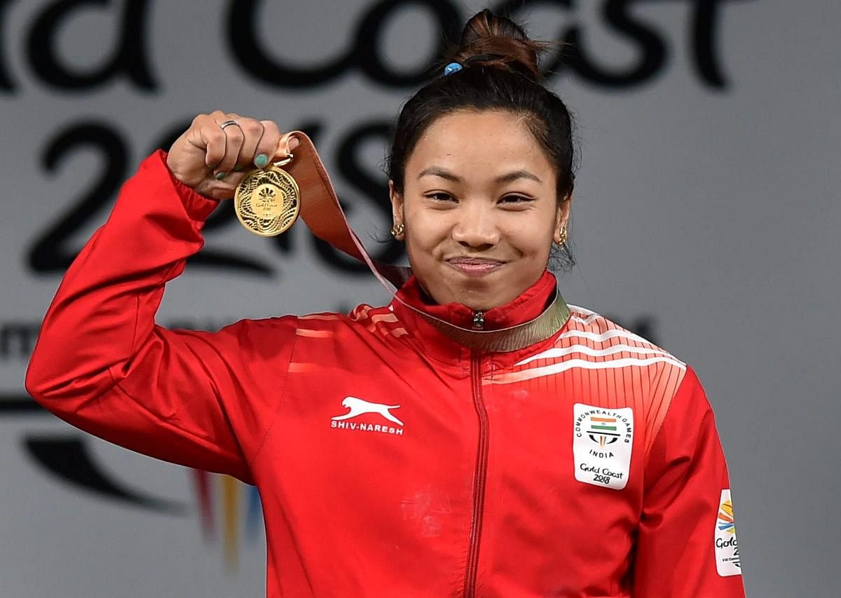 Gold medalist Indian weightlifter Chanu Saikhom poses for a photo during the medal ceremony of women's 48kg weightlifting event during the Commonwealth Games 2018 in Gold Coast, on Thursday. (PTI Photo)