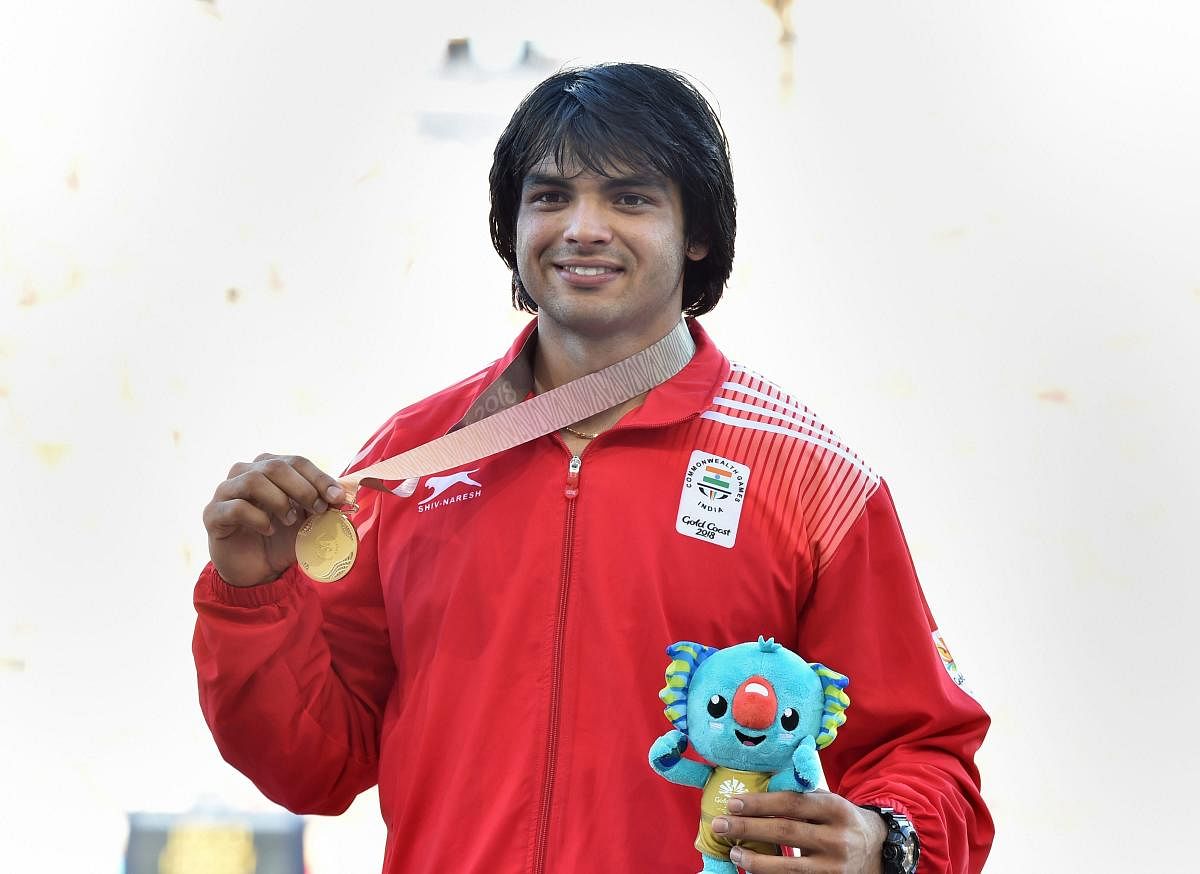 India's Neeraj Chopra shows his gold medal at the medal ceremony of men's javelin throw event during the Commonwealth Games 2018 in Gold Coast, Australia on Saturday. (PTI Photo)
