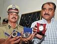 THE BOOTY: Joint Commissioner (Crime) Alok Kumar and Police Commissioner Shankar Bidari showing the wristwatches, costing Rs 27 lakh each,  that were