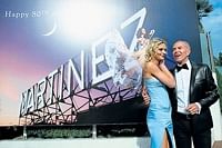 French designer Jean-Claude Jitrois (right) poses with French model Sarah Marshall on the Croisette on Tuesday,