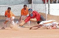 Nellamakkada team members trying to defend when a member of Kaliyanda team trying to score a goal during the semi-final of Mandepanda Cup in Ammathi