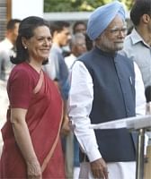 Congress party President Sonia Gandhi (L),and Prime Minister Manmohan Singh address the media in New Delhi  on Satiurday. AP
