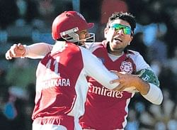 Kumar Sangakkara and Yuvraj Singh celebrate the latters second hat-trick of IPL II in Johannesburg on Sunday. AP