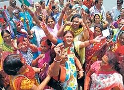 Congress supporters celebrate their partys victory in Allahabad on Sunday. REUTERS