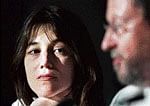 French actor Charlotte Gainsbourg, left, looks on as Danish  director Lars Von Trier speaks during a press conference for the film Antichrist. AP