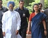 Indian PM Manmohan Singh (L) and Congress President Sonia Gandhi walk to  UPA meeting at Gandhi's residence. AFP