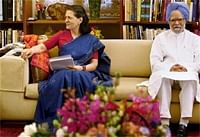 UPA Chairperson Sonia Gandhi with PM Manmohan Singh during UPA meeting at 10 Janpath. PTI