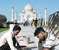 Labour of love? Maintenance work at the Taj Mahal, Agra.