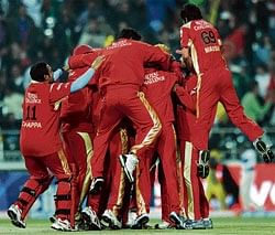 The Royal Challengers players celebrate their six-wicket victory over the Chennai Super Kings at the Wanderers on Saturday. AFP