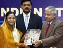 President Pratibha Patil receives momento from DGBIS, Sharad Gupta during the International Standard Organisation's Committee for Consumer Policies.