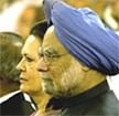 Prime Minister Manmohan Singh and Congress party President Sonia Gandhi look on during the swearing-in-ceremony of new ministers.AP