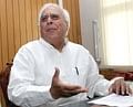 Human Resource Development Minister Kapil Sibal assumes charge at his office in New Delhi on Friday. PTI
