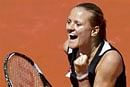 ungarian Agnes Szavay exults after scalping American Venus Williams in the French Open. AFP