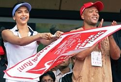 Bollywood actress Deepika Padukone and US Athlete Maurice Greene cheer for the participants at the Sunfeast World 10K Marathon in Bangalore on Sunday.