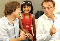 Director of  'Slumdog Millionare' Danny Boyle (R), producer Christian Colson (L) and child star Rubina Ali. AFP