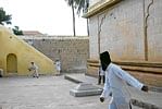 The Tipu Legacy :A game of cricket in the premises of the Masjid-e-Ala. Photo by  Anil Purohit