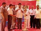 MLA D S Suresh inaugurating the Grow sandalwood, save country, earn money programme. DH Photo