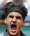 War cry: Roger Federer exults after his battling five-set win over Tommy Haas in Paris on Monday. AFP